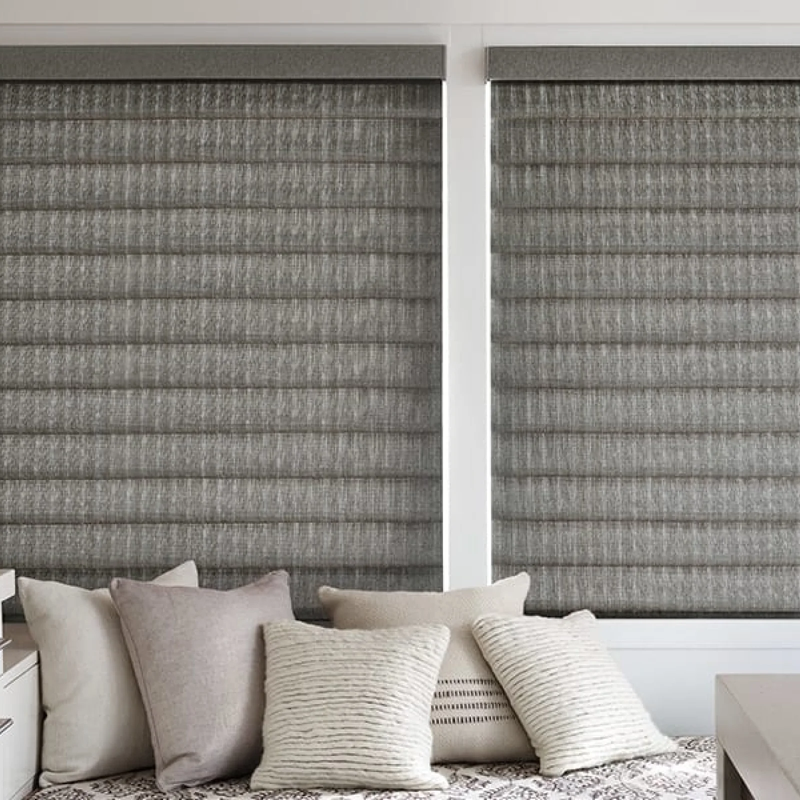 Blinds installed in sitting nook with large windows