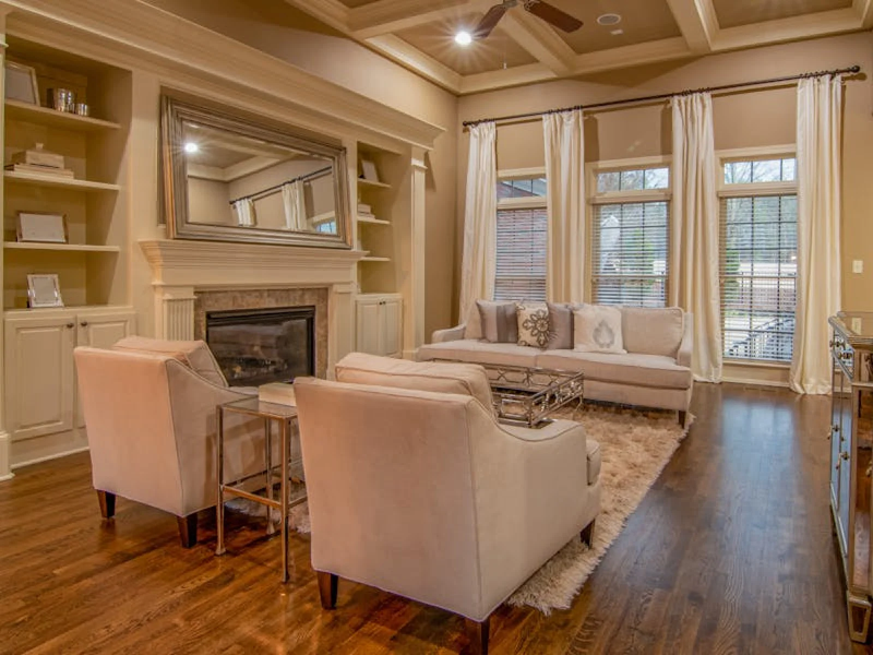 Natural stained hardwood installed in a maximalist design living room
